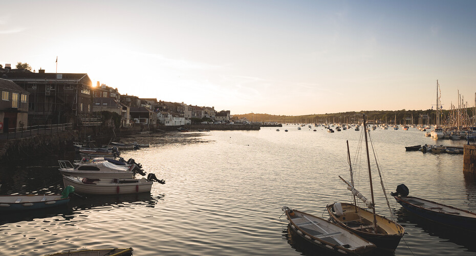 The sun setting over Falmouth harbour