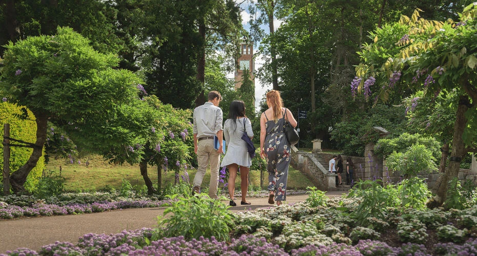 Students walking through the Reed Hall gardens on Streatham Campus