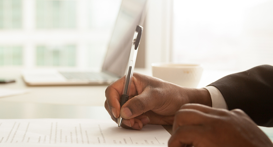Hands holding a pen