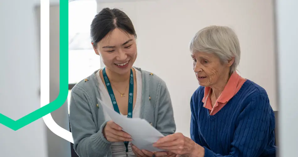 A PhD student talking to an older lady