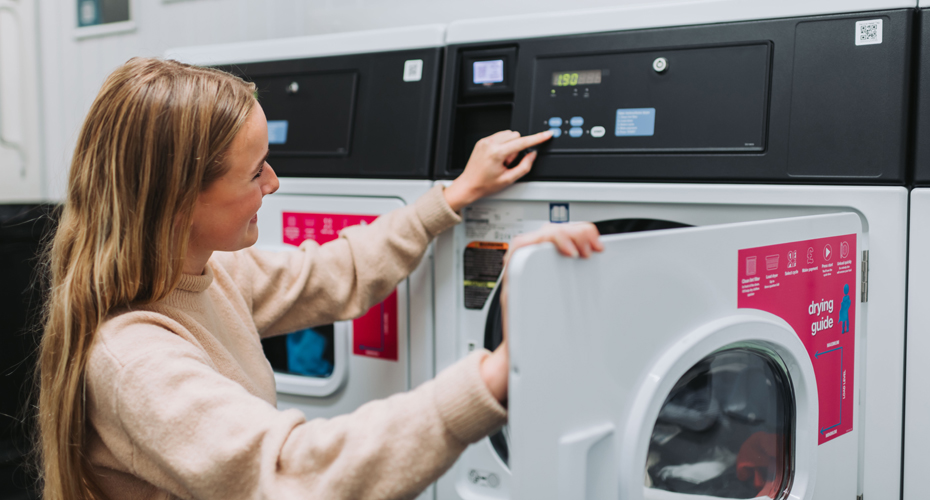 Student using washing machine