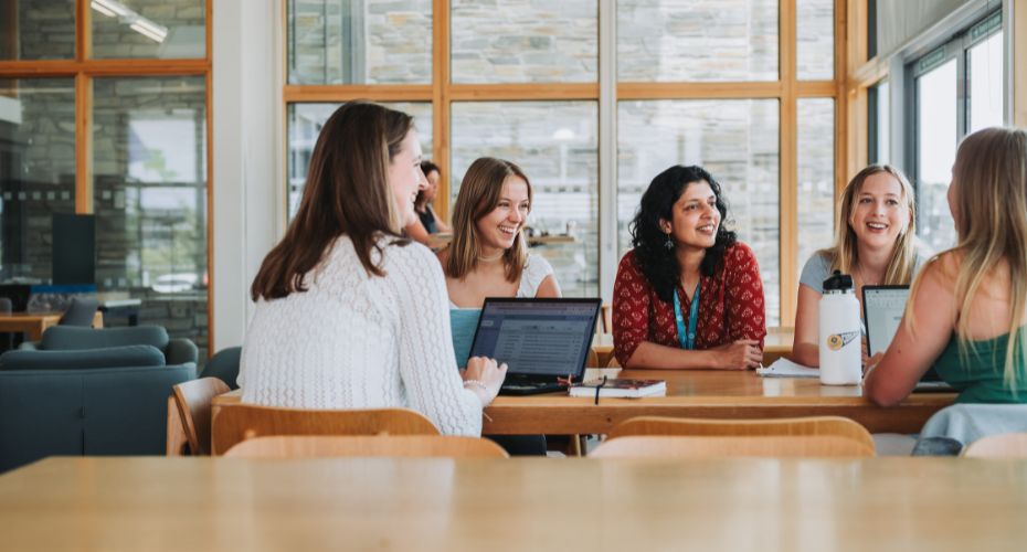 Lecturer talking to students