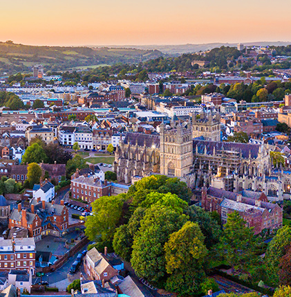 A bustling cityscape with towering buildings and lush green trees creating a harmonious urban oasis.