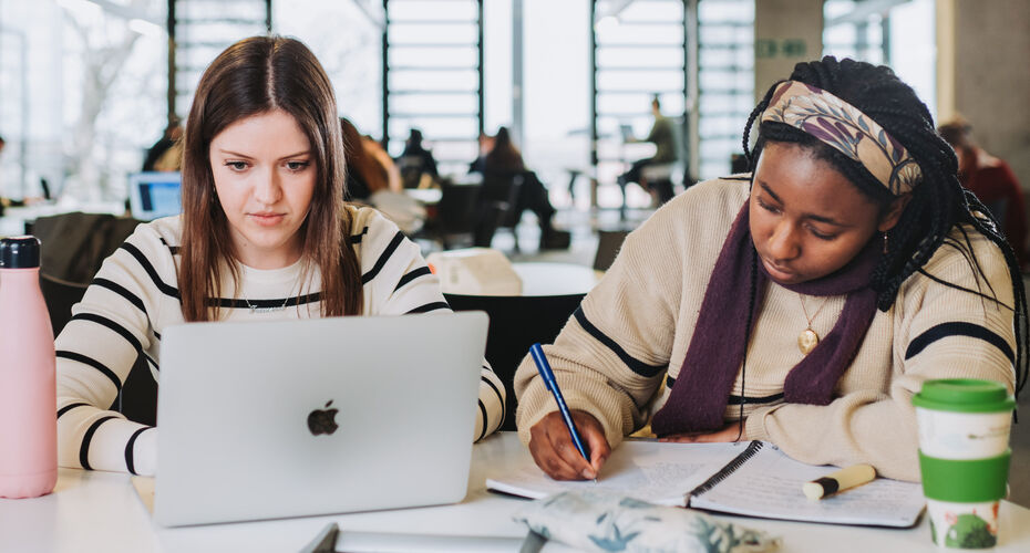 Students in Penryn, one is using laptop