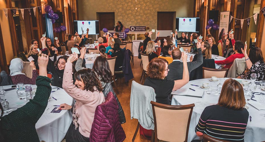 The Wellbeing, Inclusion and Culture Committee voting on a matter by raising their hands