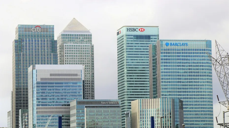 A vibrant cityscape of Canary Wharf, London, highlighting its distinctive architecture and financial district atmosphere.
